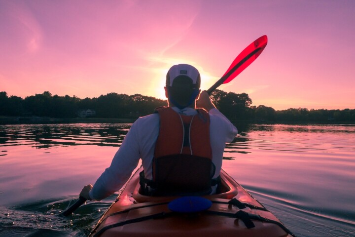 kayak paddler red sky